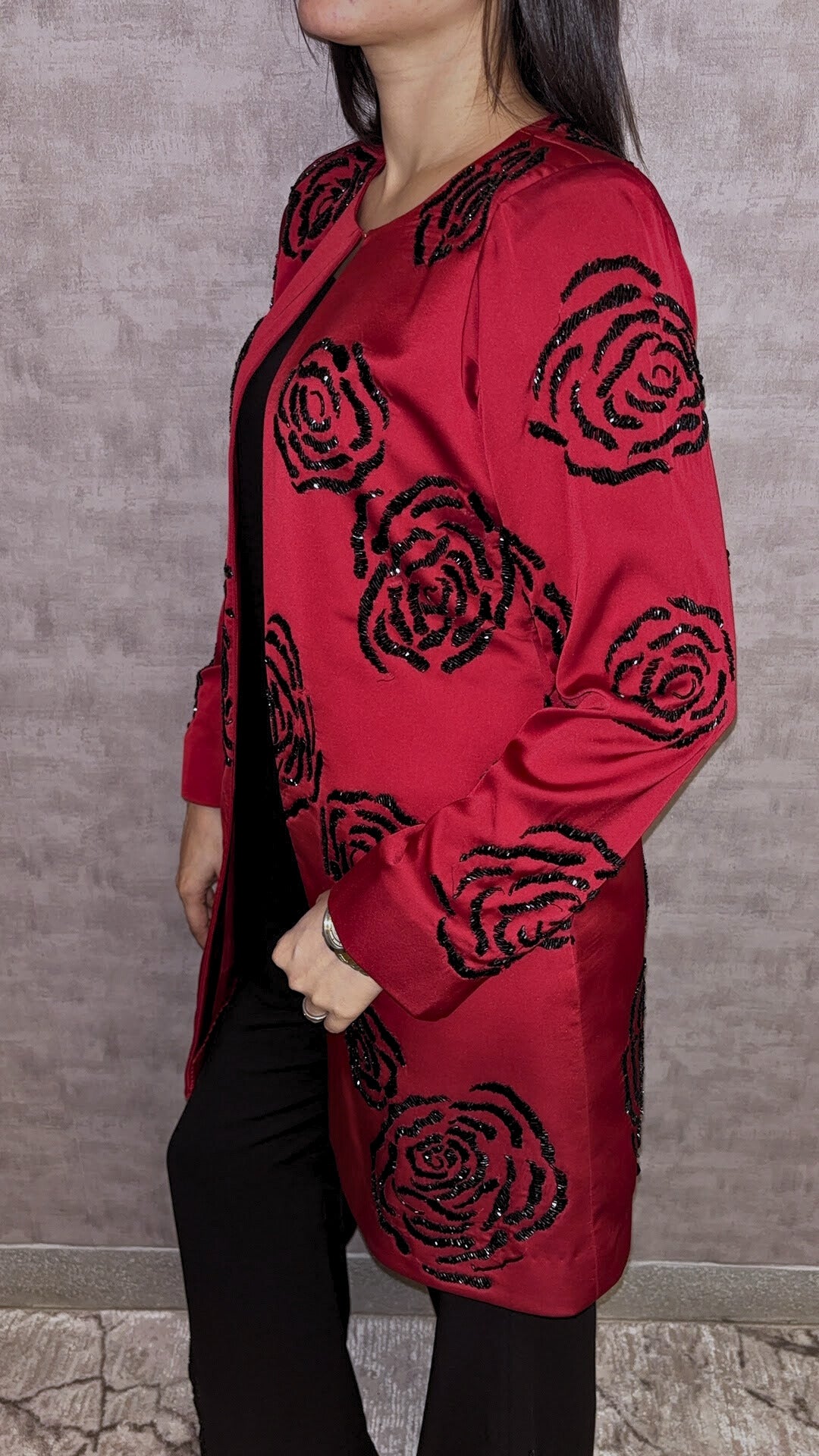 From Taraashi's exclusive Platinum Collection, the Satin Rose 3 Piece Set exudes undeniable glamour. A stunning red satin jacket showcases bold, dimensional black rose embellishments, a detail echoed subtly on the coordinating black trousers. Layered over a sleek inner top, this striking ensemble balances high-impact drama with sophisticated artistry. Command attention with the unforgettable style unique to our Platinum pieces.