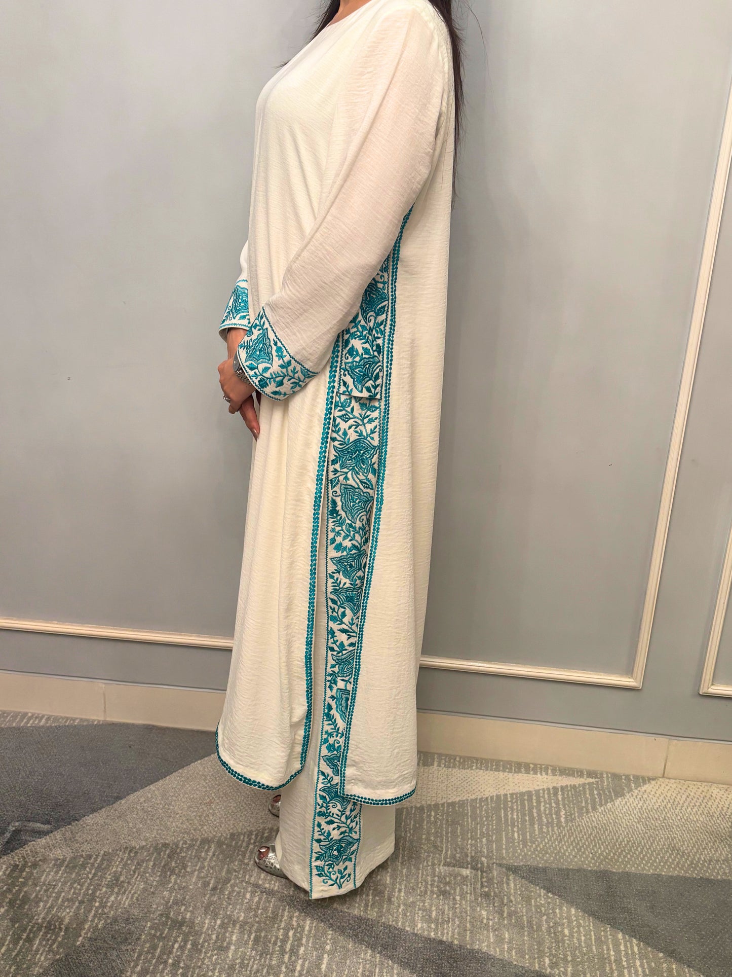 Grace finds its purest form in this ivory kurti set — where every drape whispers luxury and every thread is an ode to femininity. Crafted for evenings that linger and moments that matter, this ensemble pairs timeless charm with modern detail. From the fluid fall of the fabric to the delicate play of textures, this is not just attire — it’s presence, poised.