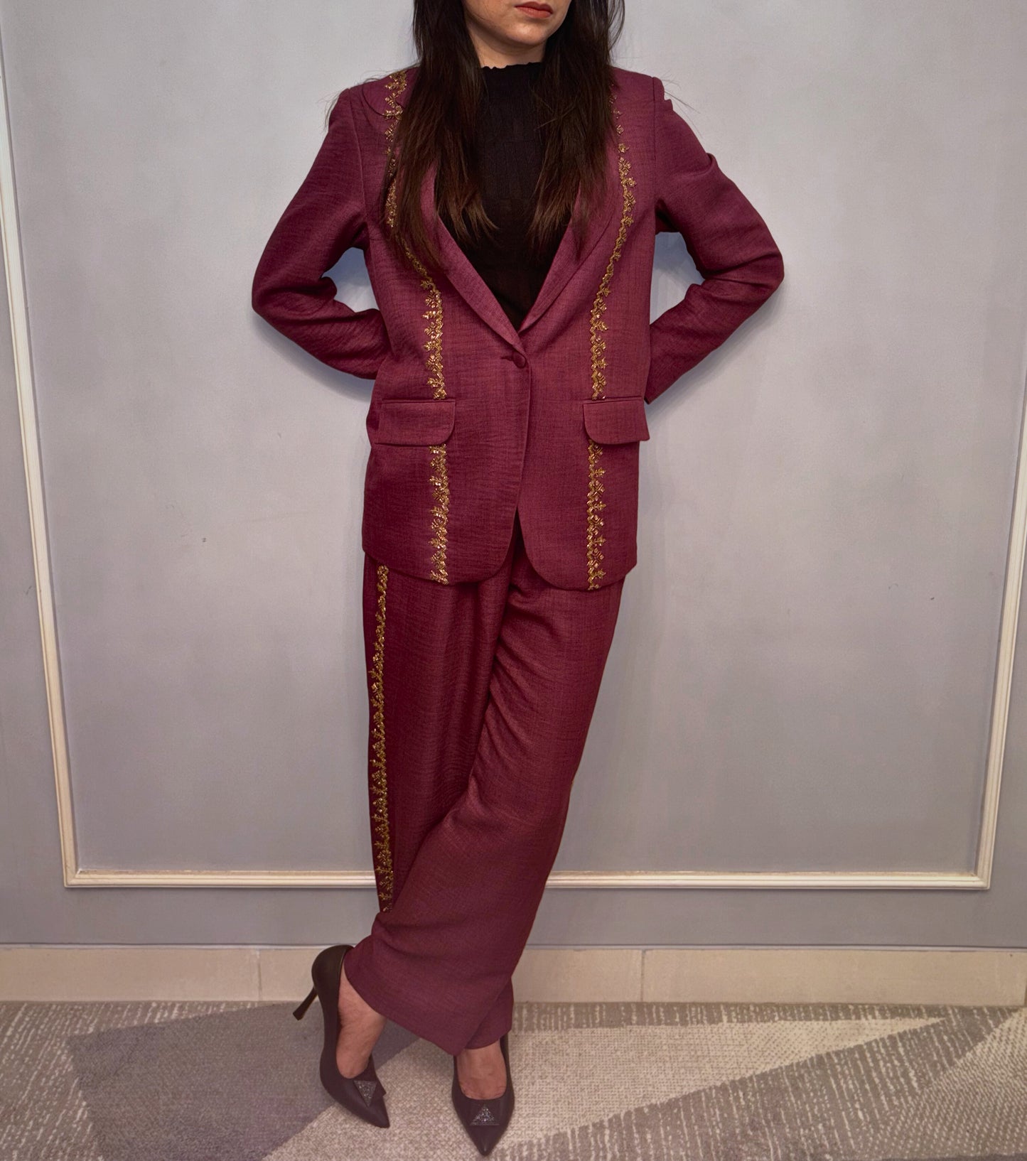 A rich ode to timeless femininity, the Mulberry Gold&nbsp;pantsuit is woven in deep maroon with gilded embroidery that gently kisses every curve of its tailored silhouette. This Taraashi Platinum piece brings together old-world refinement and contemporary minimalism — a look that doesn’t speak loudly, yet leaves a lasting impression.

For soirées, for silences, for the woman who glows without trying.