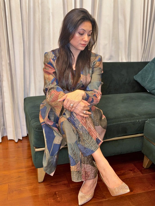 Make a statement with the Abstract Flora Silk Co-ord Set from Taraashi, our Platinum collection of luxury South Asian women's ethnic wear. This sophisticated two-piece ensemble showcases a captivating abstract design in rich jewel tones and subtle metallic accents, woven into a luxurious art silk fabric. The tailored yet comfortable silhouette exudes modern elegance.

Perfect for elevated social gatherings and expressing your unique style, this refined co-ord set embodies artistic sophistication.