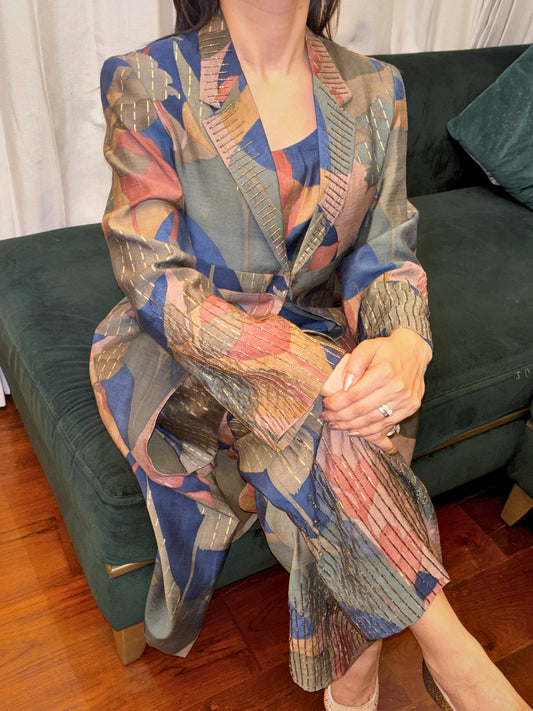 Make a statement with the Abstract Flora Silk Co-ord Set from Taraashi, our Platinum collection of luxury South Asian women's ethnic wear. This sophisticated two-piece ensemble showcases a captivating abstract design in rich jewel tones and subtle metallic accents, woven into a luxurious art silk fabric. The tailored yet comfortable silhouette exudes modern elegance.

Perfect for elevated social gatherings and expressing your unique style, this refined co-ord set embodies artistic sophistication.
