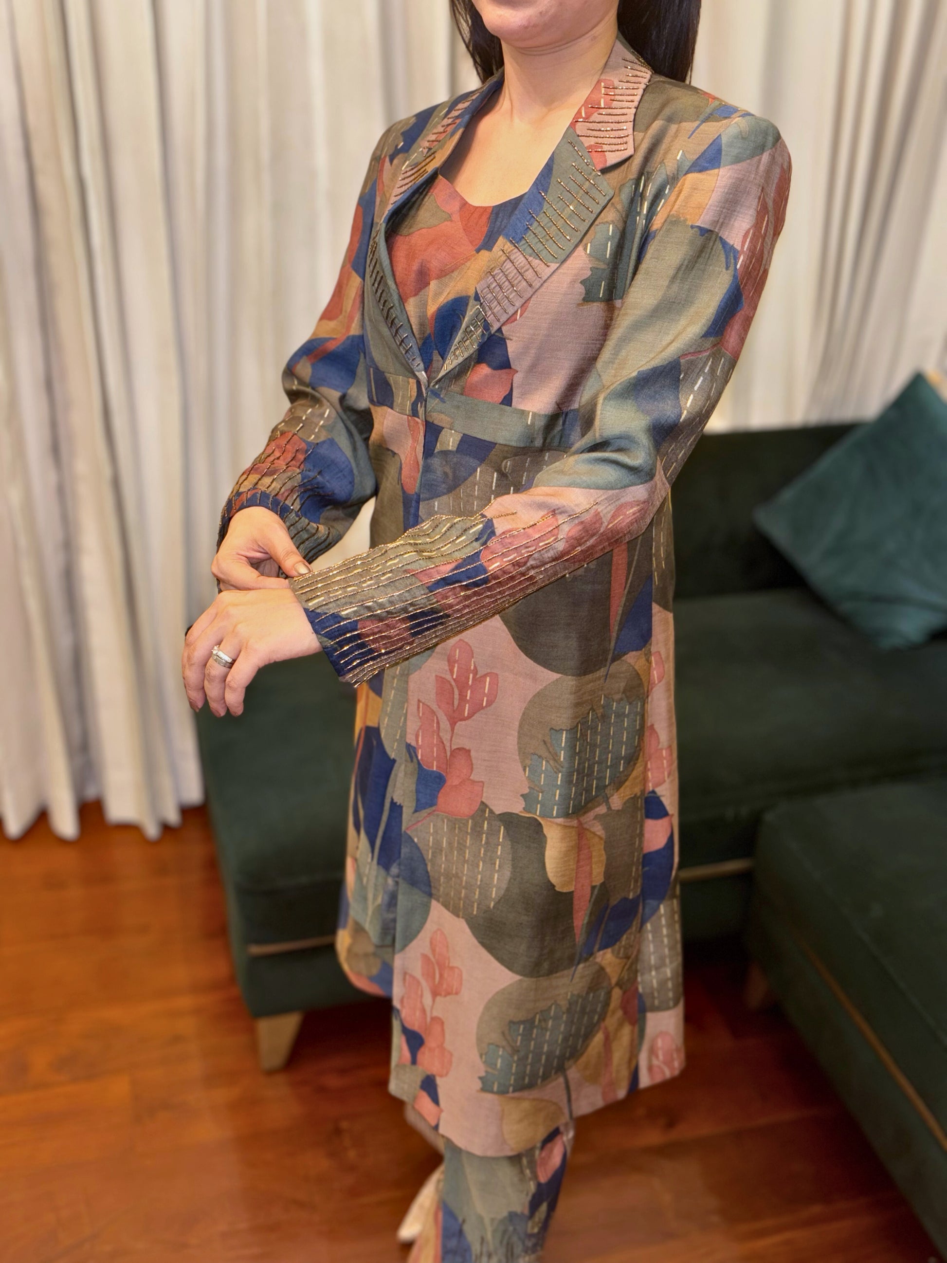 Make a statement with the Abstract Flora Silk Co-ord Set from Taraashi, our Platinum collection of luxury South Asian women's ethnic wear. This sophisticated two-piece ensemble showcases a captivating abstract design in rich jewel tones and subtle metallic accents, woven into a luxurious art silk fabric. The tailored yet comfortable silhouette exudes modern elegance.

Perfect for elevated social gatherings and expressing your unique style, this refined co-ord set embodies artistic sophistication.