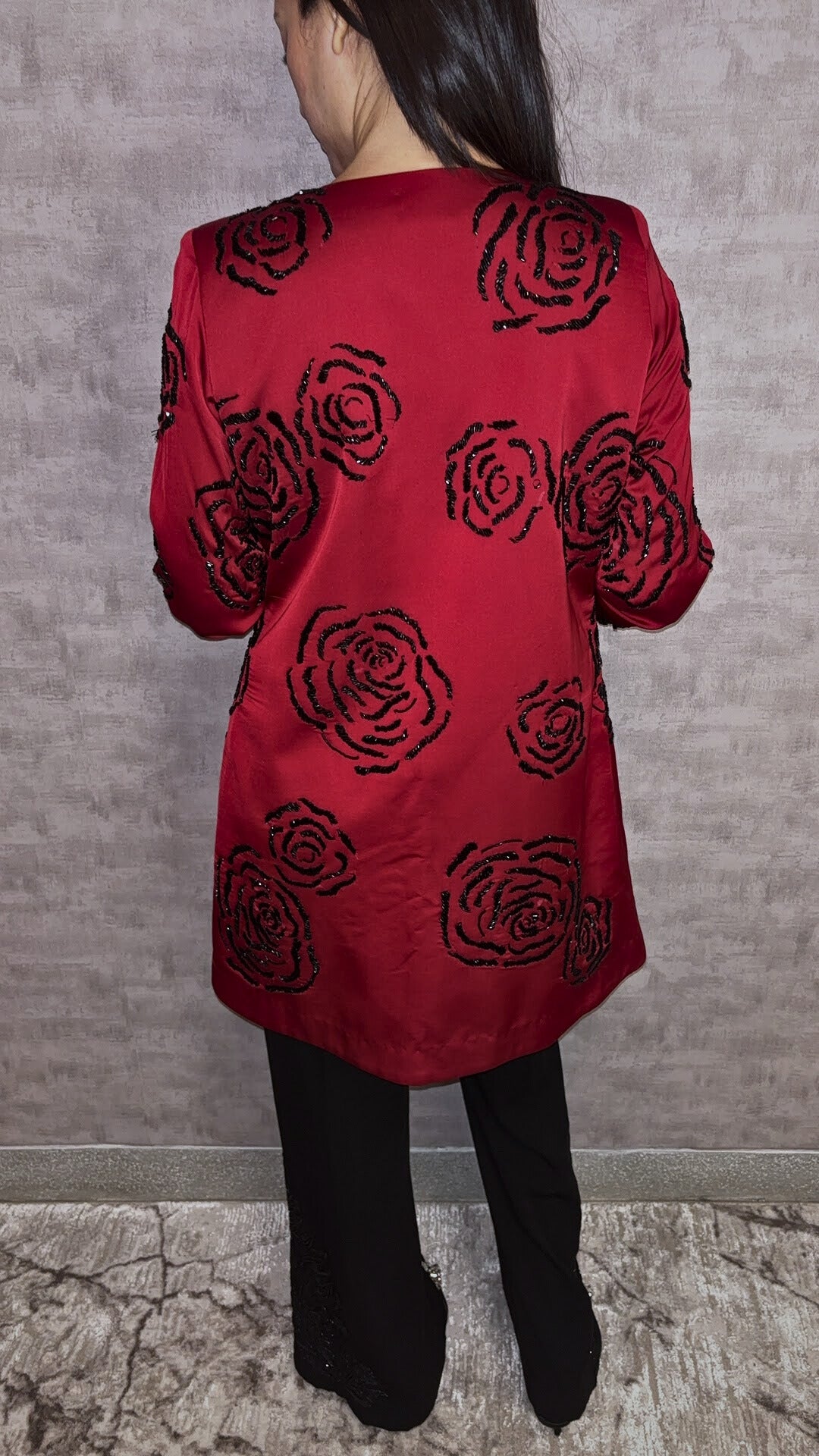 From Taraashi's exclusive Platinum Collection, the Satin Rose 3 Piece Set exudes undeniable glamour. A stunning red satin jacket showcases bold, dimensional black rose embellishments, a detail echoed subtly on the coordinating black trousers. Layered over a sleek inner top, this striking ensemble balances high-impact drama with sophisticated artistry. Command attention with the unforgettable style unique to our Platinum pieces.